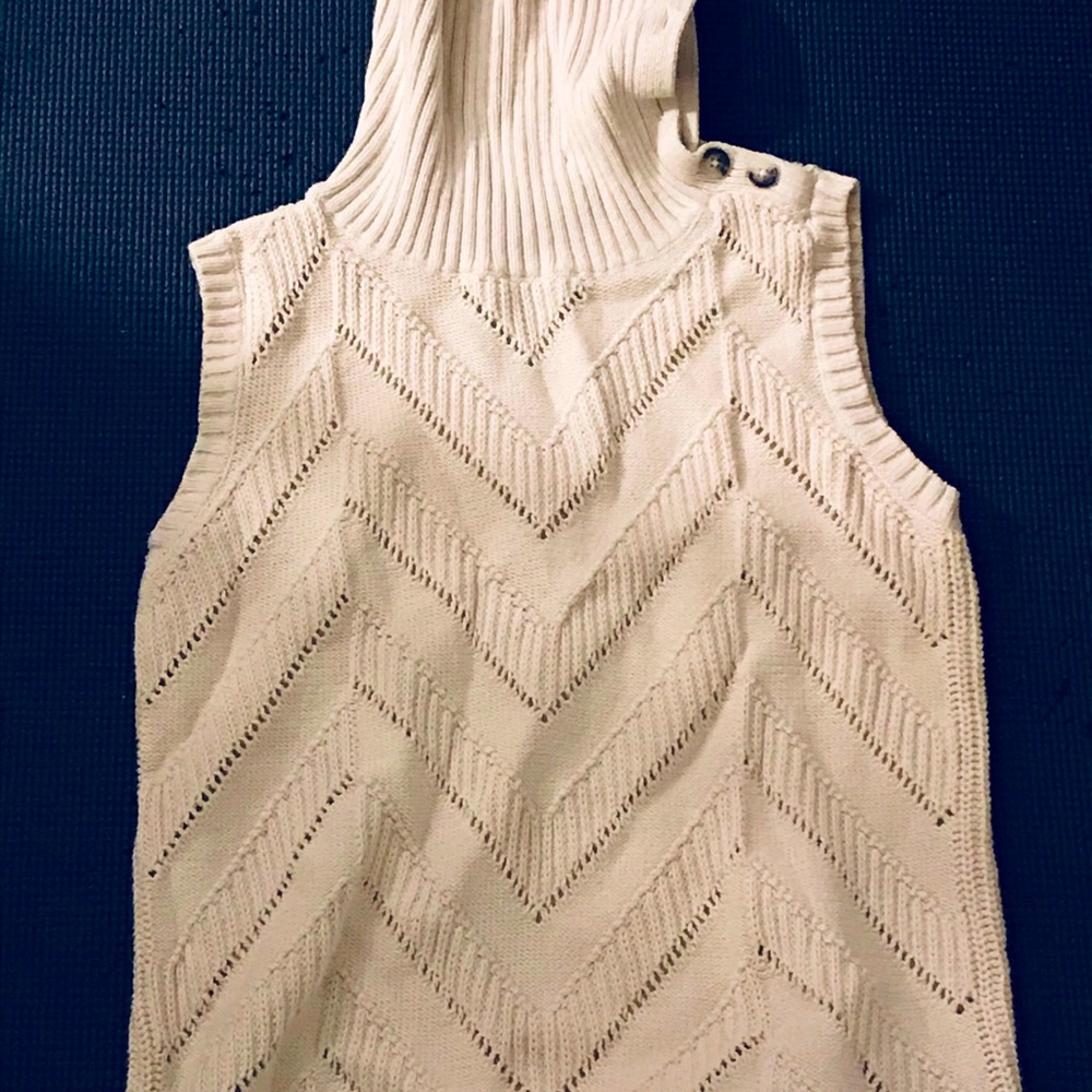 Sleeveless, cream turtleneck sweater